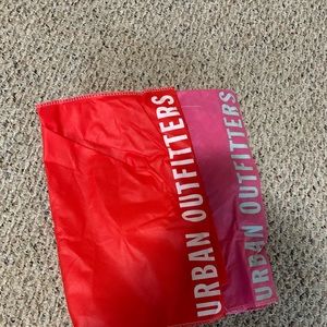 Pink and red urban outfitters bag